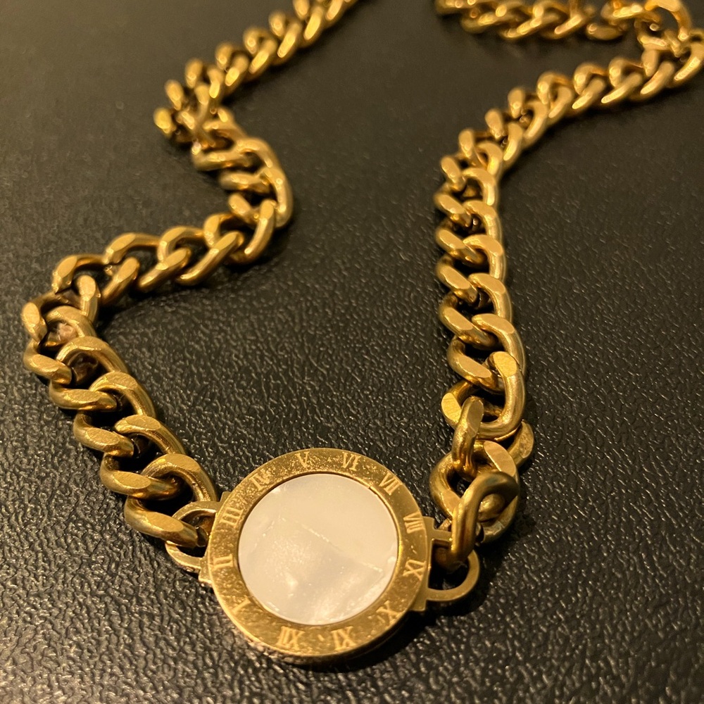 Gold necklace with white stone
